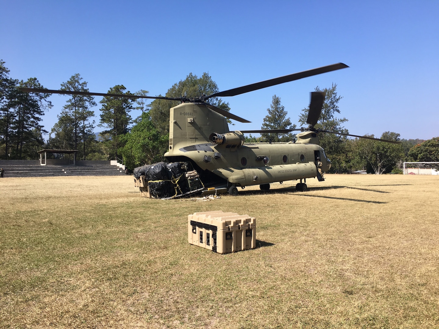 A CH-47 Chinook helicopter from JTF-Bravo's 1st Battalion, 228 Aviation Regiment unloads a pallet of equipment and supplies during a deployment readiness exercise of the U.S. Southern Command Situational Assessment Team (SSAT) in Zambrano, Honduras, Feb. 21 through 23. The SSAT is a quick-reaction deployable team comprised of experts that provide the commander of USSOUTHCOM an immediate assessment of conditions and unique Department of Defense requirements which might be needed during a Humanitarian Assistance, Disaster Response event within the Central American Area of Responsibility.