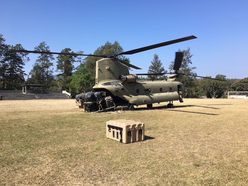 A CH-47 Chinook helicopter from JTF-Bravo's 1st Battalion, 228 Aviation Regiment unloads a pallet of equipment and supplies during a deployment readiness exercise of the U.S. Southern Command Situational Assessment Team (SSAT) in Zambrano, Honduras, Feb. 21 through 23. The SSAT is a quick-reaction deployable team comprised of experts that provide the commander of USSOUTHCOM an immediate assessment of conditions and unique Department of Defense requirements which might be needed during a Humanitarian Assistance, Disaster Response event within the Central American Area of Responsibility.