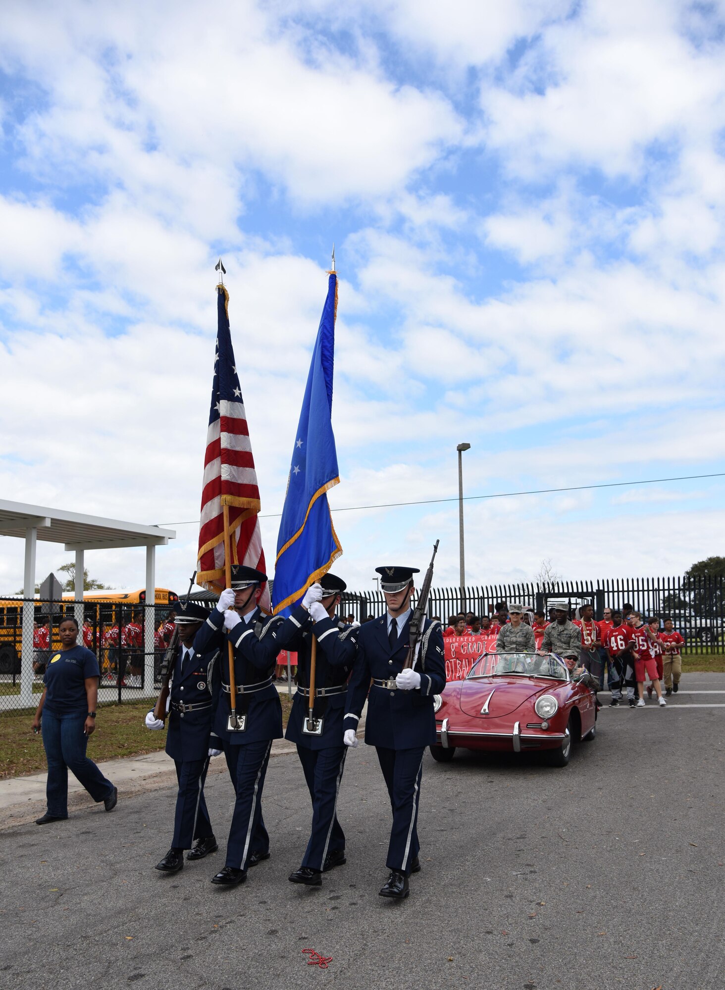 Members of the Keesler Air Force Base Honor Guard lead the Jeff Davis Elementary School Mardi Gras Parade, Feb. 24, 2017, Biloxi, Miss. Keesler leadership and other base personnel also participated in the festivities. (U.S. Air Force photo by Kemberly Groue)