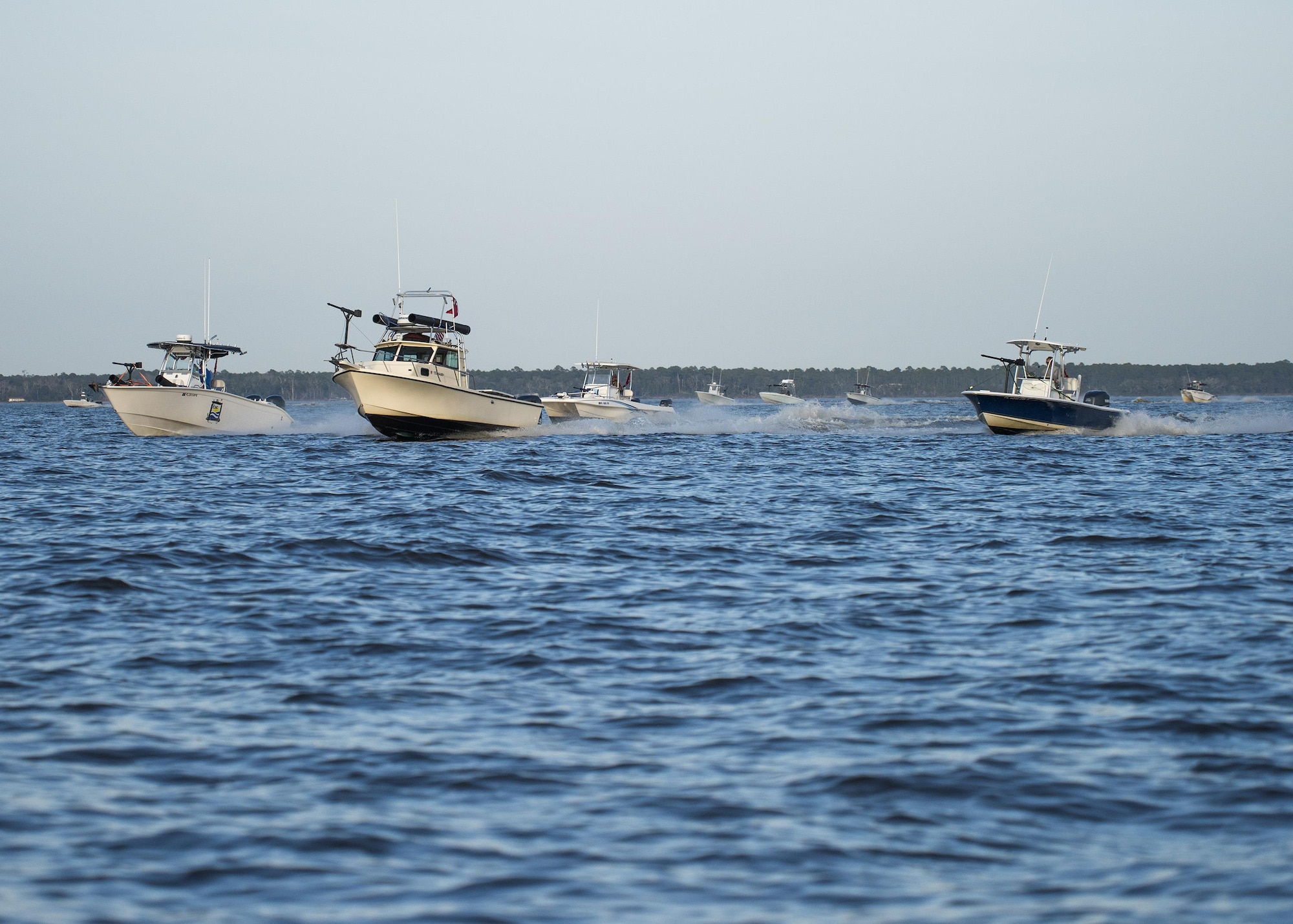 Local boat captains and mariners operate fishing boats equipped with makeshift guns and weapons invaded the Choctawatchee Bay area Feb. 6 during the 86th Fighter Weapons Squadron exercise, Combat Hammer. The boat swarms helped create a realistic environment to provide exercise participants an opportunity to train like they fight. (U.S. Air Force/Ilka Cole)