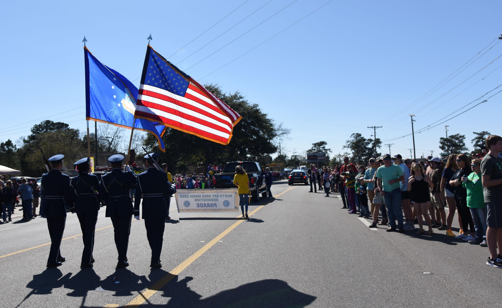 Members of the Keesler Air Force Base Honor Guard lead the North Bay Area Mardi Gras Parade Feb. 26, 2017, St. Martin, Miss. Every Mardi Gras season, Keesler personnel participate in local parades to show their support of the communities surrounding the installation. (U.S. Air Force photo by Kemberly Groue)