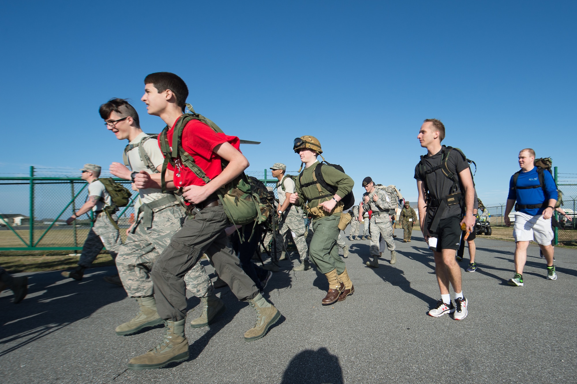 Participants the 18th Annual Security Forces Ruck March leave the starting line Feb 25, 2017, on Dover Air Force Base, Del. The first, second and third place teams as well as the fastest individual participant received trophies. (U.S. Air Force photo by Mauricio Campino)