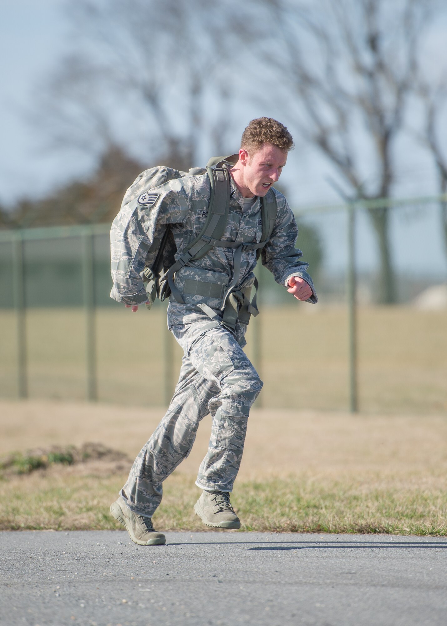 Staff Sgt. Jon Porubsky, 811th Security Forces Squadron, approaches the finish line at the 18th Annual Security Forces Ruck March on Feb. 25, 2017, on Dover Air Force Base, Del. Porubsky ran the 10 kilometer course with the fastest time of 54 minutes, 23 seconds while carrying a 30-pound ruck on his back. (U.S. Air Force photo by Mauricio Campino)