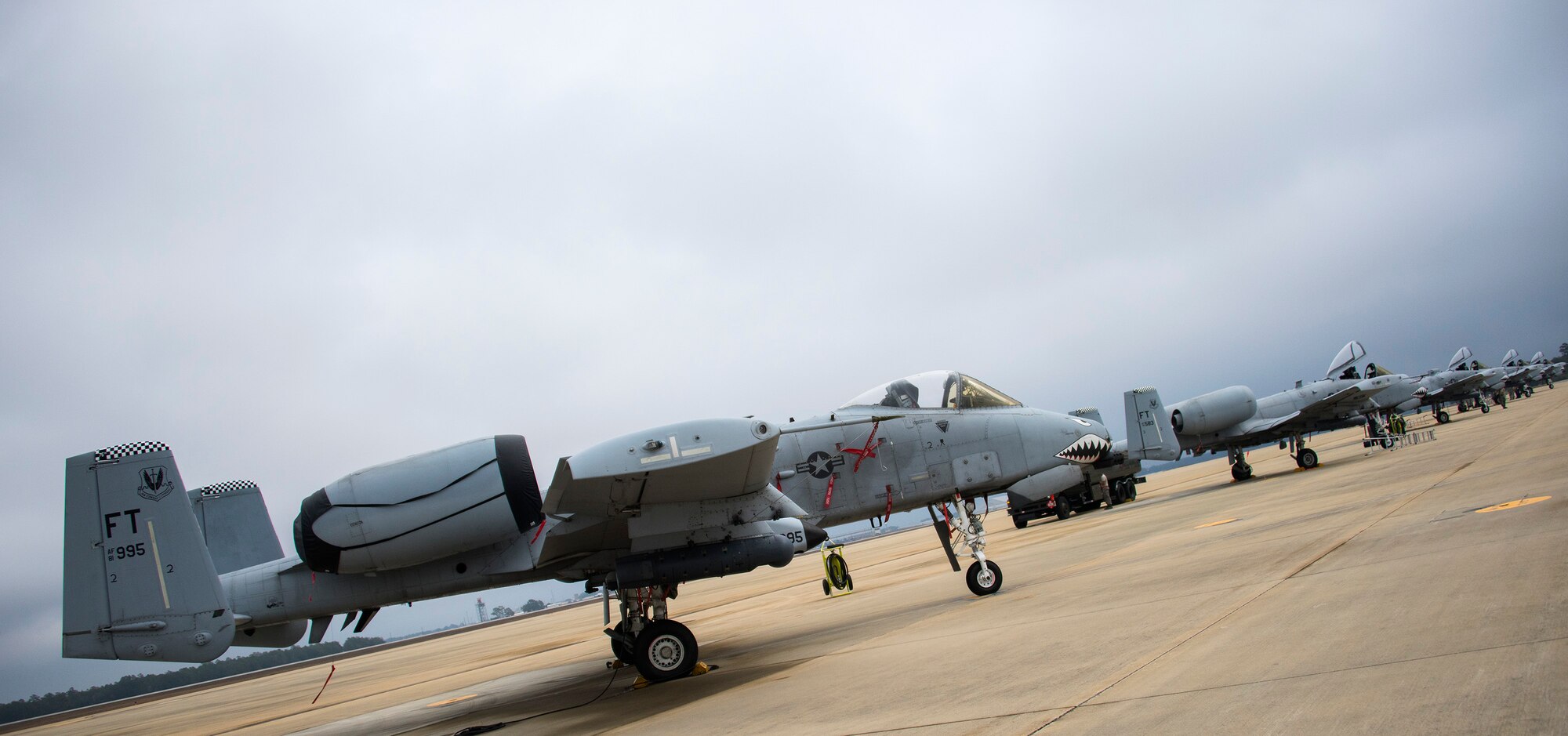 A-10 Thunderbolt IIs with the 74th Fighter Squadron from Moody Air Force Base, Ga., line the runway to receive fuel and maintenance Feb. 7 during Combat Hammer.   The 86th Fighter Weapons Squadron’s Combat Hammer is a weapons system evaluation program at Eglin Air Force Base, Fla. (U.S. Air Force photo/Ilka Cole)