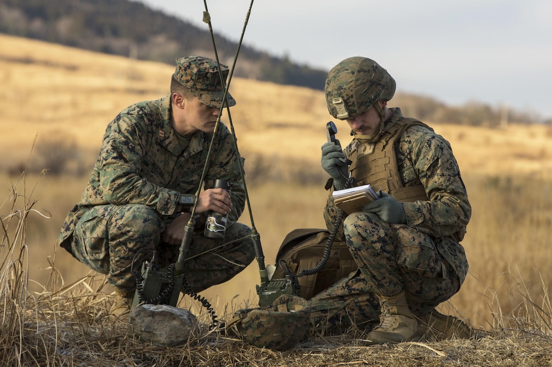Marine Corps 2nd Lt. Jolyon Gidari, right, calls in a 9-line medevac request during a casualty evacuation drill at the Hijudai Maneuver Area, Japan, Feb. 25, 2017.  Gidari is a platoon commander assigned to the 12th Marine Regiment and attached to Alpha Battery, 1st Battalion, 3rd Battalion. Marine Corps photo by Lance Cpl. Christian J. Robertson