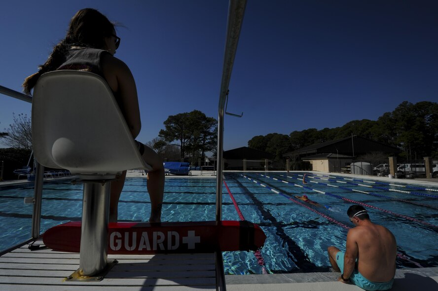 Bekka Boyd, left, a lifeguard at the Hurlburt Field Aquatic Center on Hurlburt, watches over Air Commandos swimming at the aquatic center on Hurlburt Field, Fla., Feb. 14, 2017. The aquatic center reopened Feb. 1, 2017, after renovations were made to the pool deck and bathrooms, and a handicap lift was installed. (U.S. Air Force photo by Airman 1st Class Dennis Spain)