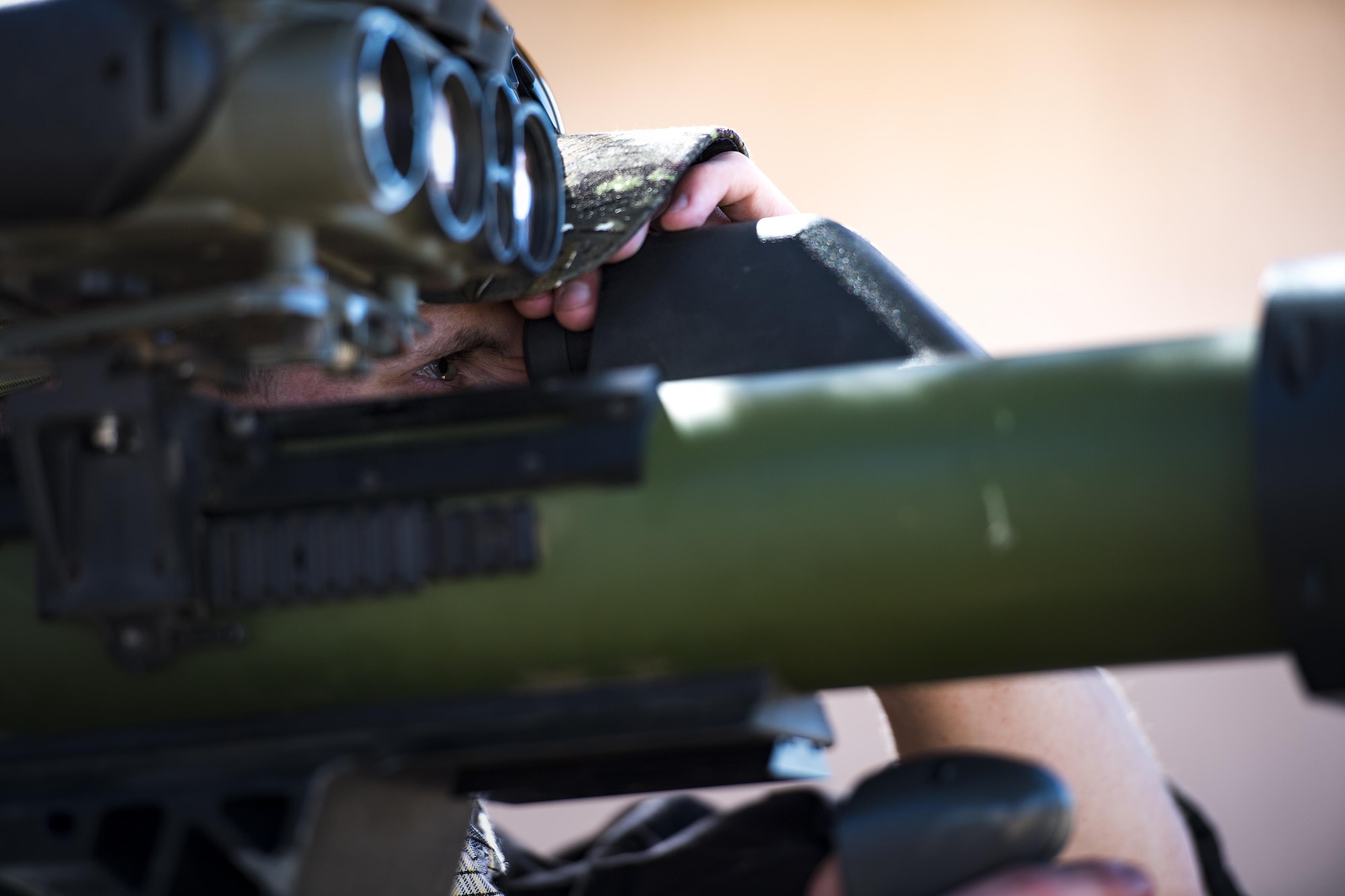 Senior Airman Keaton Houser, 563d Operations Support Squadron, uses a man-portable aircraft survivability trainer to simulate threats on aircraft, Feb. 22, 2017, at the Playas Training and Research Center, N.M. OPFOR is a role designed to simulate downrange threats and complicate training objectives with the ultimate goal of creating a realistic training environment for units preparing to deploy. Airmen from the 563d OSS fill this role in support of numerous joint exercises each year utilizing aircraft-threat emitters, vehicle-mounted simulation weapons and waves of ground troops. (U.S. Air Force photo by Staff Sgt. Ryan Callaghan)