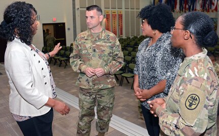 (From left) Brenda Clark, U.S. Army Medical Department Center and School sexual assault response coordinator, or SARC, discusses the Army Sexual Harassment/Assault Response and Prevention, or SHARP, program with Command Sgt. Maj. Aaron Stone, 187th Medical Battalion; Nykita Riley, SARC, 32nd Medical Brigade; and Maj. Felicia Williams, AMEDDC&S victim advocate.