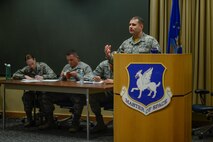 Master Sgt. Matt Lofton, 2nd Space Operations Squadron, argues for the Top III Council during the Schriever Debate at Schriever Air Force Base, Colorado, Friday, Feb. 24, 2017.  The Top III won the debate, which asked whether the Air Force should bring back warrant officers.  (U.S. Air Force photo/Christopher DeWitt)