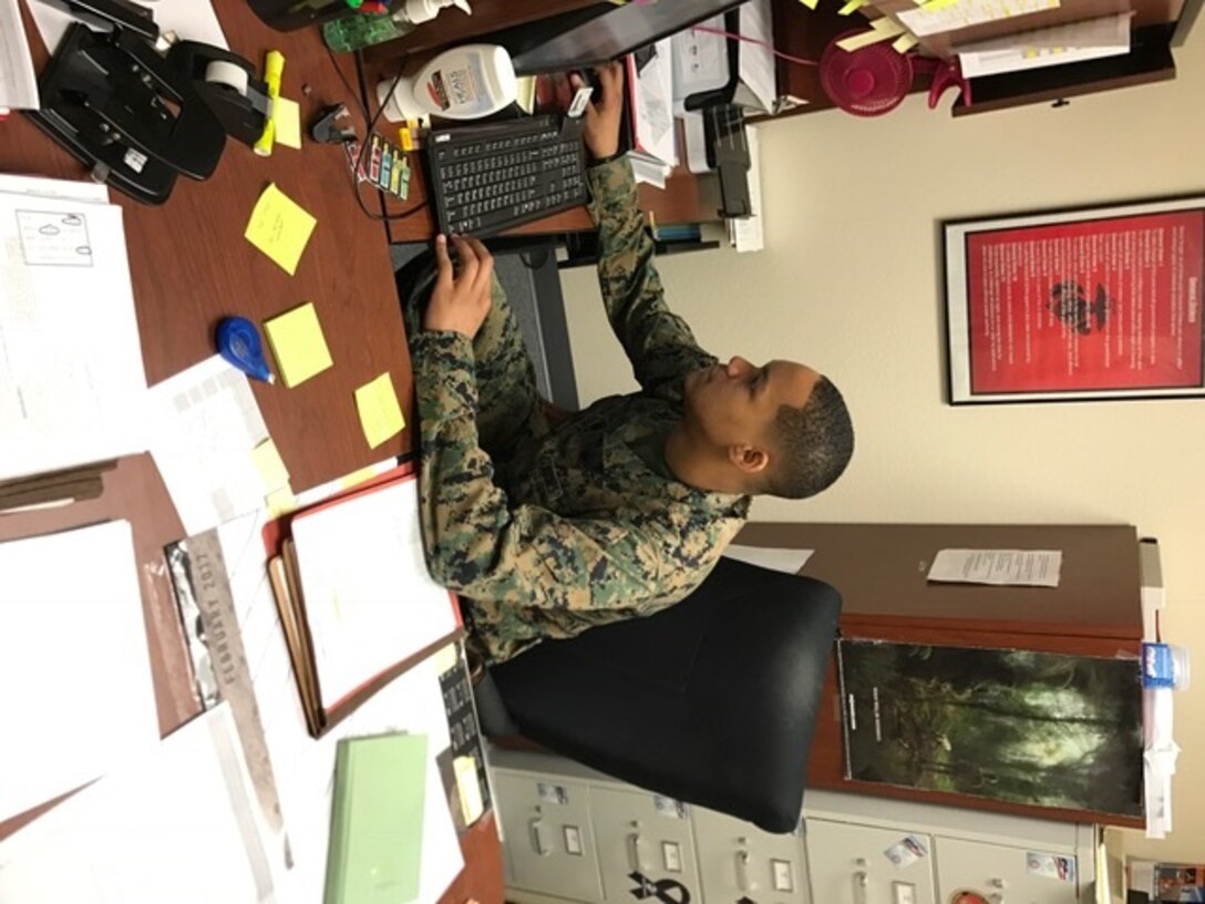 Cpl James W. Holiday II of Headquarters Company, Marine Corps Communication-Electronics School assists end users in backing up their computers in preparation for a tech refresh. Cpl Holiday will help users back-up their desktops and assist them in the transition process with their new computers.               