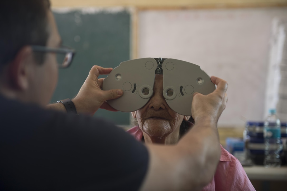 Navy Lt. Cmdr. Paul Mayo performs an eye exam on a patient as part of Continuing Promise 2017 in Trujillo, Honduras, Feb. 21, 2017. Navy photo by Petty Officer 2nd Class Ridge Leoni