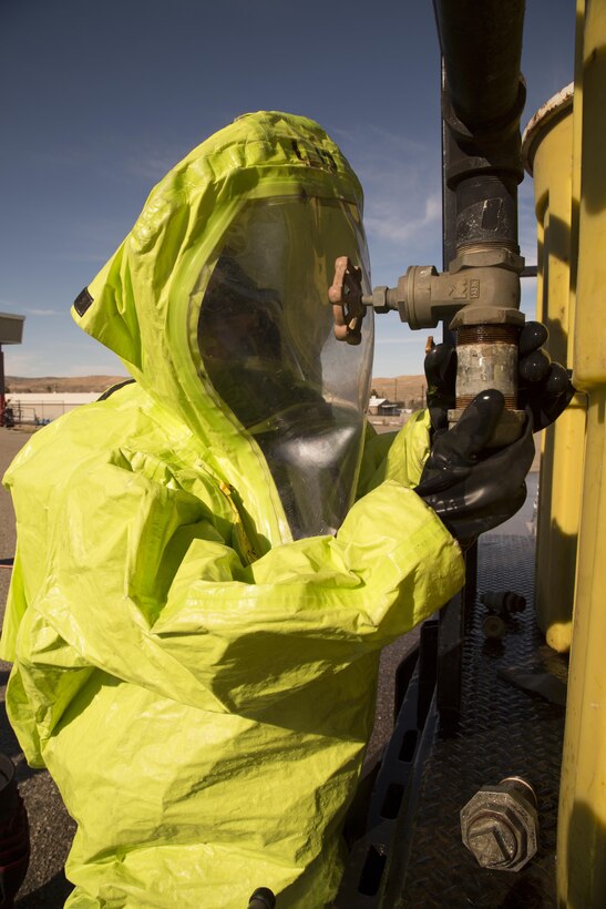 Scott Torres, firefighter and medic with Marine Corps Logistics Base Barstow's Security and Emergency Services repairs a leak on a training rig used during the hazardous materials training held aboard base, Feb. 15. The training provides realistic scenarios in which firefighters must respond with dexterity and precision.