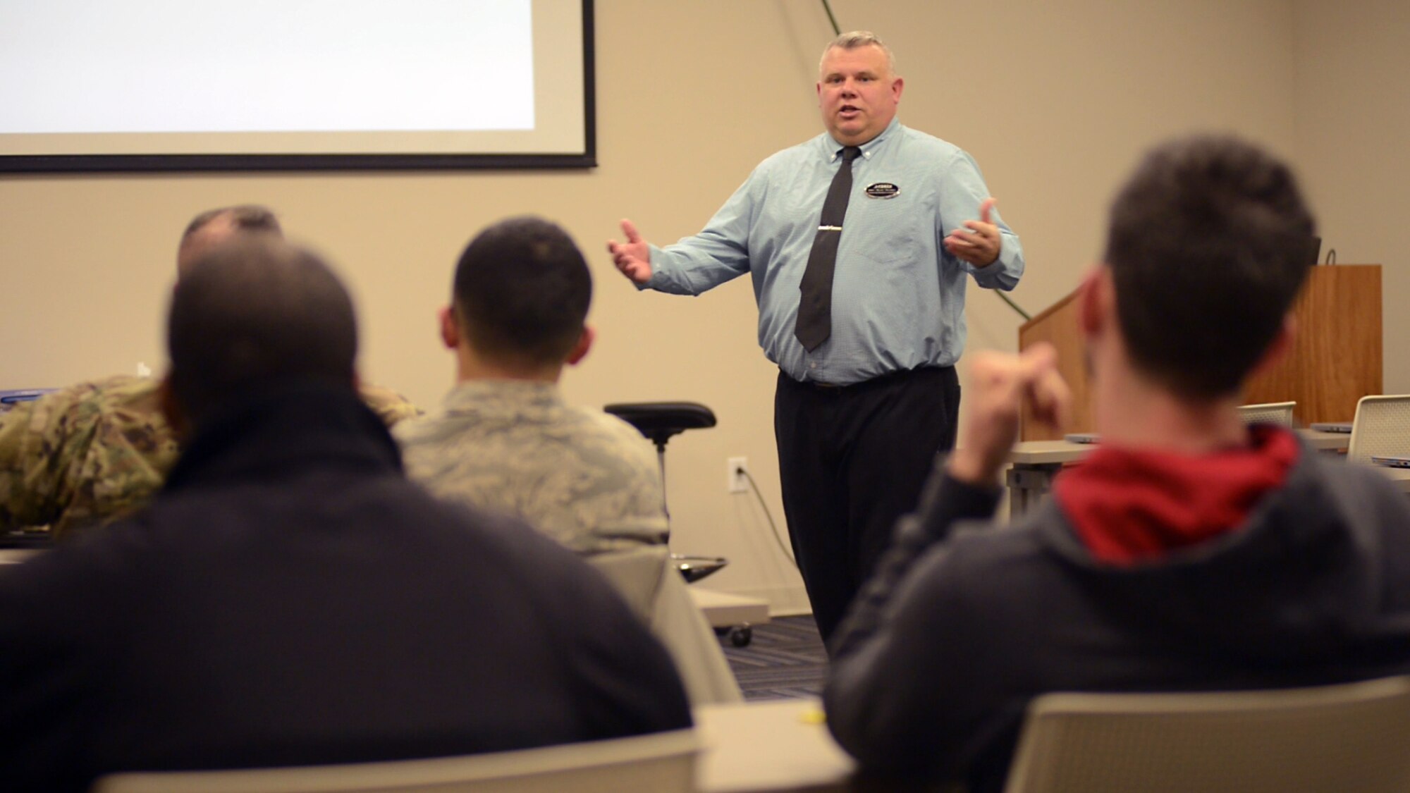 Mike “Rudy” Rudisill, Airman and Family Readiness Center community readiness consultant, leads a pre-separation briefing to service members preparing to leave the military.  The A&FRC pre-separation briefing is a prerequisite to the Transition Assistance Program’s five-day Transition Goals, Plans, Success Workshop that informs those transitioning to civilian life of services and benefits available to assist them and their spouses during and after separating. (U.S. Air Force photo by Tammy L. Reed)