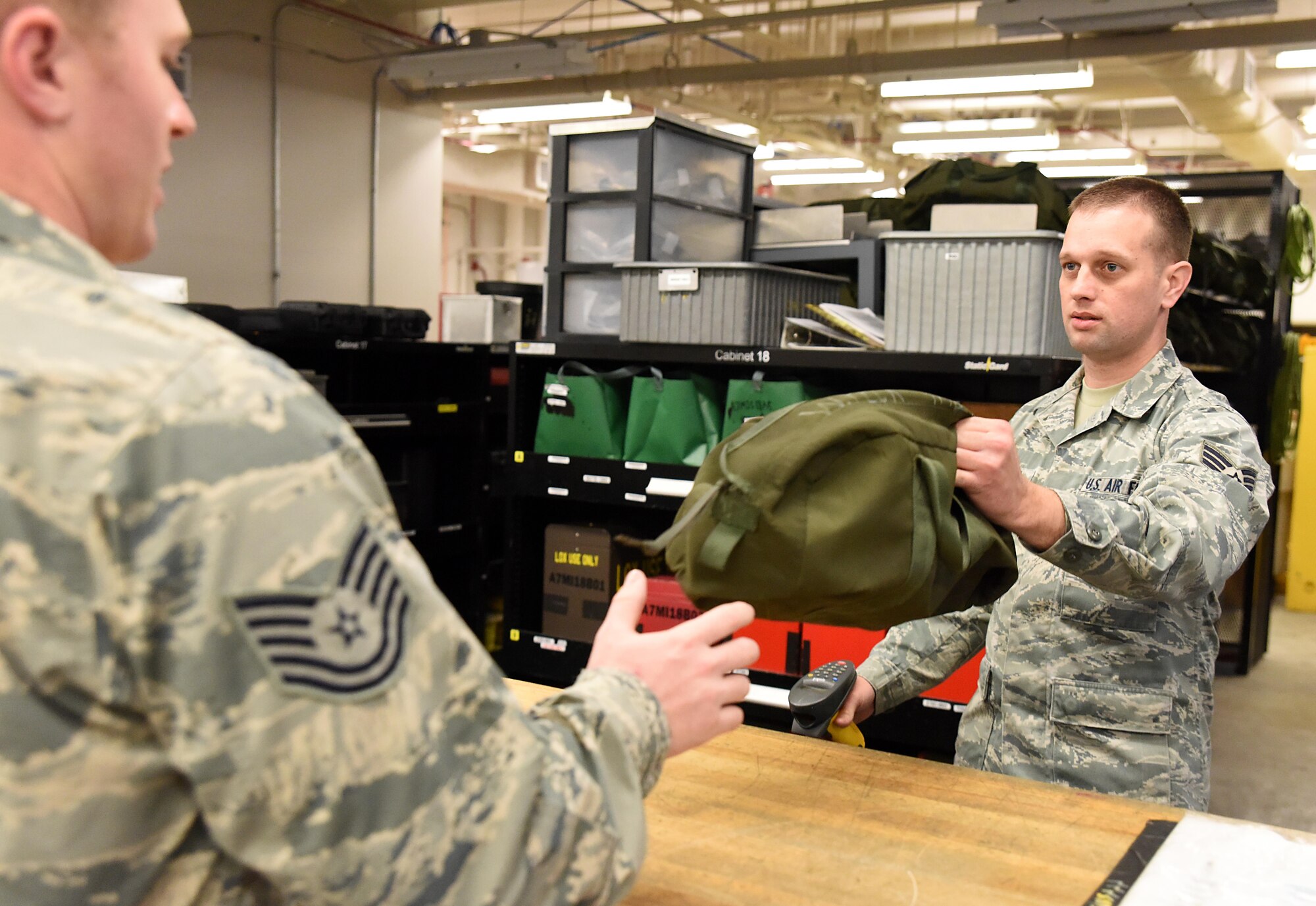 Senior Airman Borden  Moody, a 189th Maintenance Group crew chief, issues tools to a C-130H aircraft maintainer Feb. 22, 2017, at Little Rock Air Force Base, Ark. The sortie support flight is responsible for more than 14,000 pieces of individual equipment necessary to successfully carry out the 189th Airlift Wing's mission. (U.S. Air National Guard photo by Tech. Sgt. Jessica Condit)