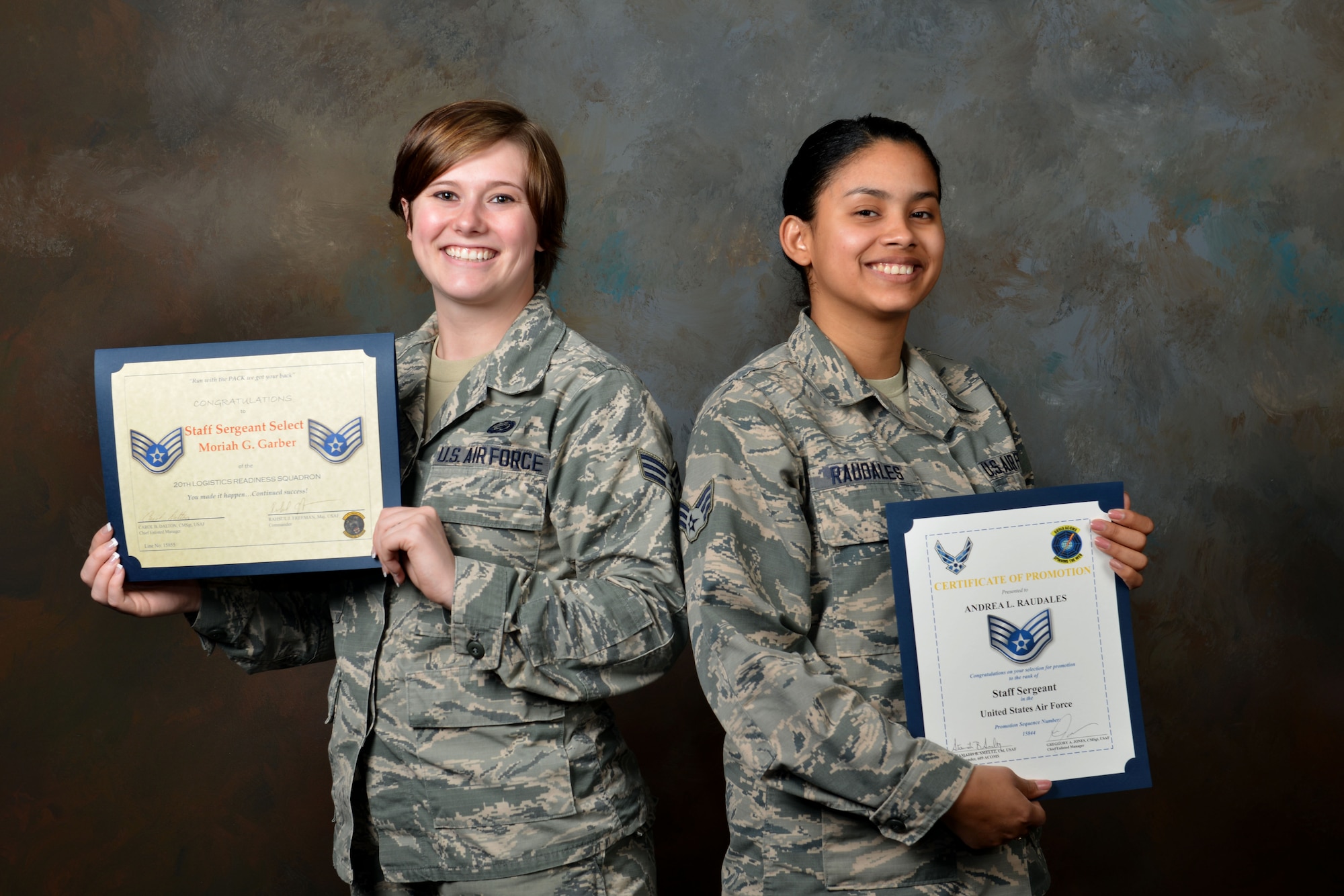 U.S. Air Force Senior Airman Andrea Raudales 609th Air Communications Squadron commander support staff (CSS) personnelist, and Senior Airman Moriah Garber, 20th Logistics Readiness Squadron CSS personnelist, smile while holding their staff sergeant-select certificates at Shaw Air Force Base, S.C., Feb. 22, 2017. Both Airmen, who have known each other since technical training, made senior airman below-the-zone as well as staff sergeant at the same time as one another. (U.S. Air Force photo by Airman 1st Class Destinee Sweeney)