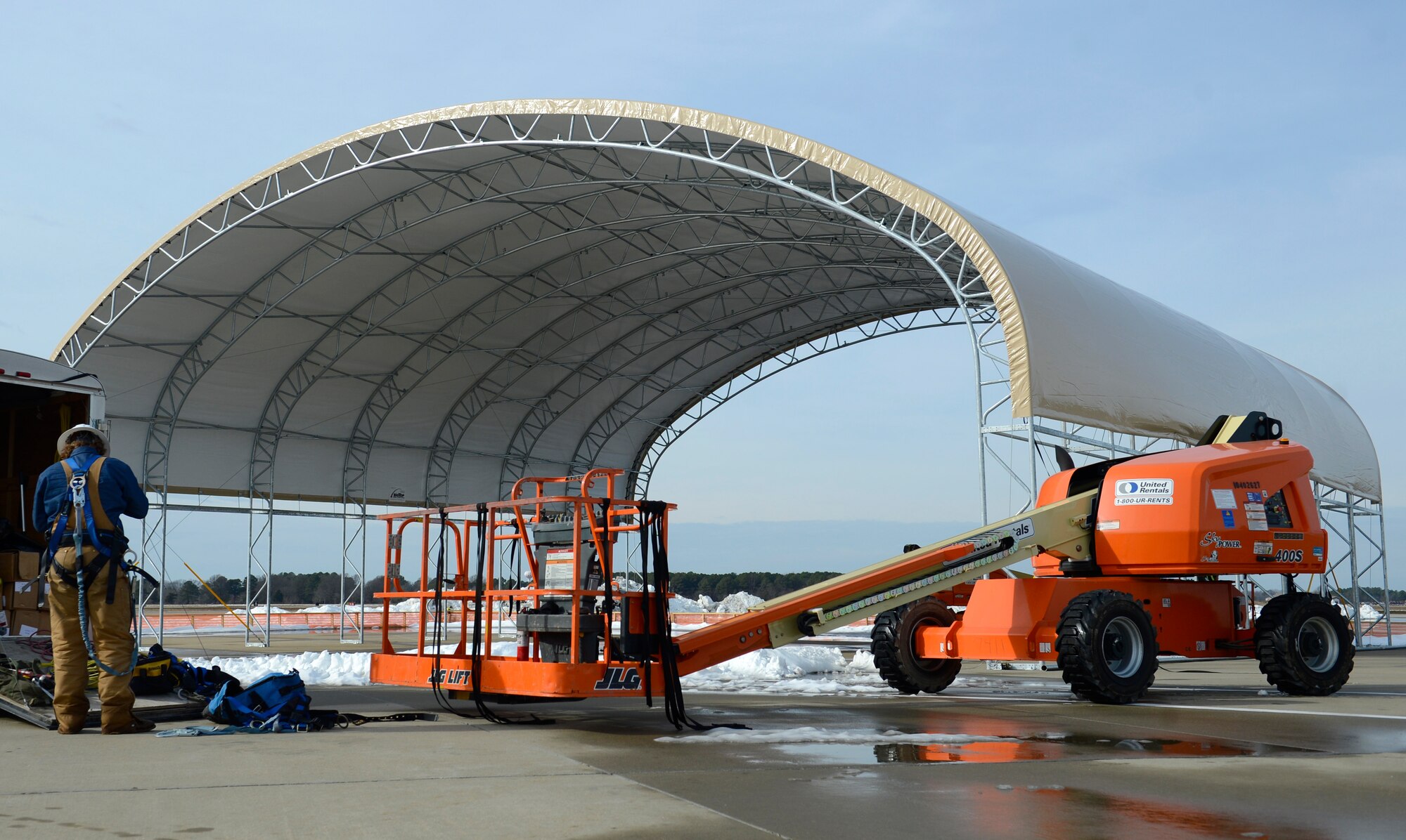 Members of the Big Top Manufacturing Company, contracted through the 633rd Contracting Squadron, build sun shades for the F-22 Raptors at Joint Base Langley-Eustis, Va., Jan. 12, 2017. The company plans to build 18 tents by the end of March 2017. (U.S. Air Force photo by Airman 1st Class Kaylee Dubois)