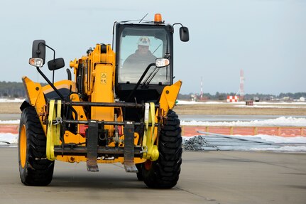 Ricky Bass, Big Top Manufacturing Company lead technician, drives a forklift at Joint Base Langley-Eustis, Va., Jan. 12, 2017. The 633rd Contracting Squadron helps units at JBLE sponsor projects that are essential for the mission. (U.S. Air Force photo by Airman 1st Class Kaylee Dubois)
