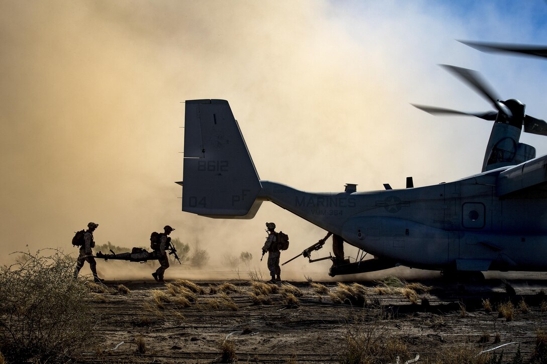 Marines load simulated patients into an MV-22 Osprey during a Special Marine Air Ground Task Force certification at the Playas Training and Research Center, N.M., Feb. 22, 2017. The certification culminated six months of Marine predeployment training and included Air Force assets from Davis-Monthan Air Force Base, and Marines and aircraft from Camp Pendleton, Calif. Air Force photo by Staff Sgt. Ryan Callaghan