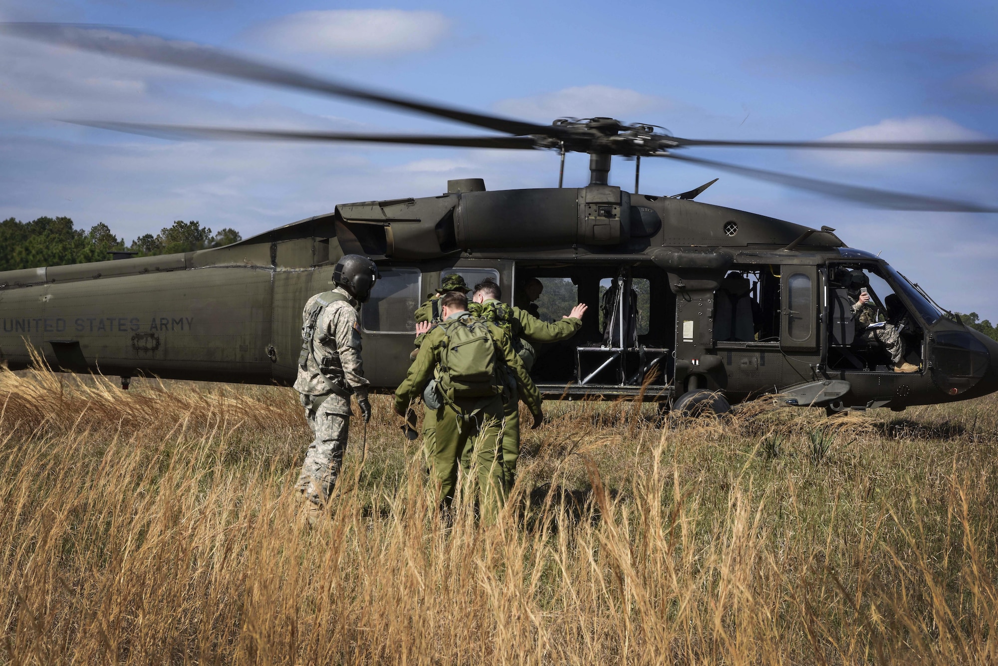 U.S. Army personnel rescue Royal Canadian Air Force crew members from the 436 Transport Squadron as part of survival, evasion, resistance and escape training conducted during Green Flag Little Rock 17-04 Feb. 10, 2017, near Alexandria, La. During the exercise, aircrew members were selected randomly to participate in SERE training. (U.S. Air Force photo by Senior Airman Stephanie Serrano)