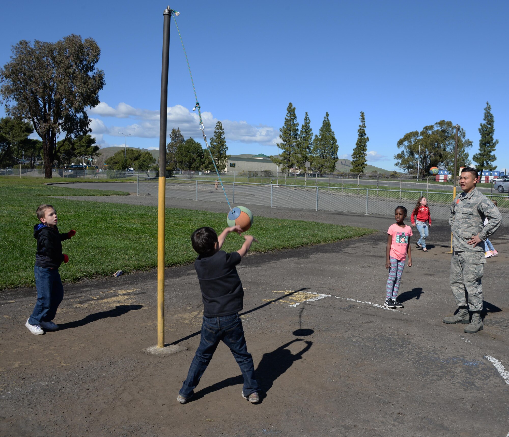 Airman 1st Class Frederick Cabling, 60th Aerial Port Squadron traffic management office, supervises children playing during recess at Travis Elementary School at Travis Air Force Base, Calif., Feb. 27, 2017. Cabling is one of nearly 70 Airmen who have volunteered at the school since Jan. 30. (U.S. Air Force photo/Tech. Sgt. James Hodgman/Released)