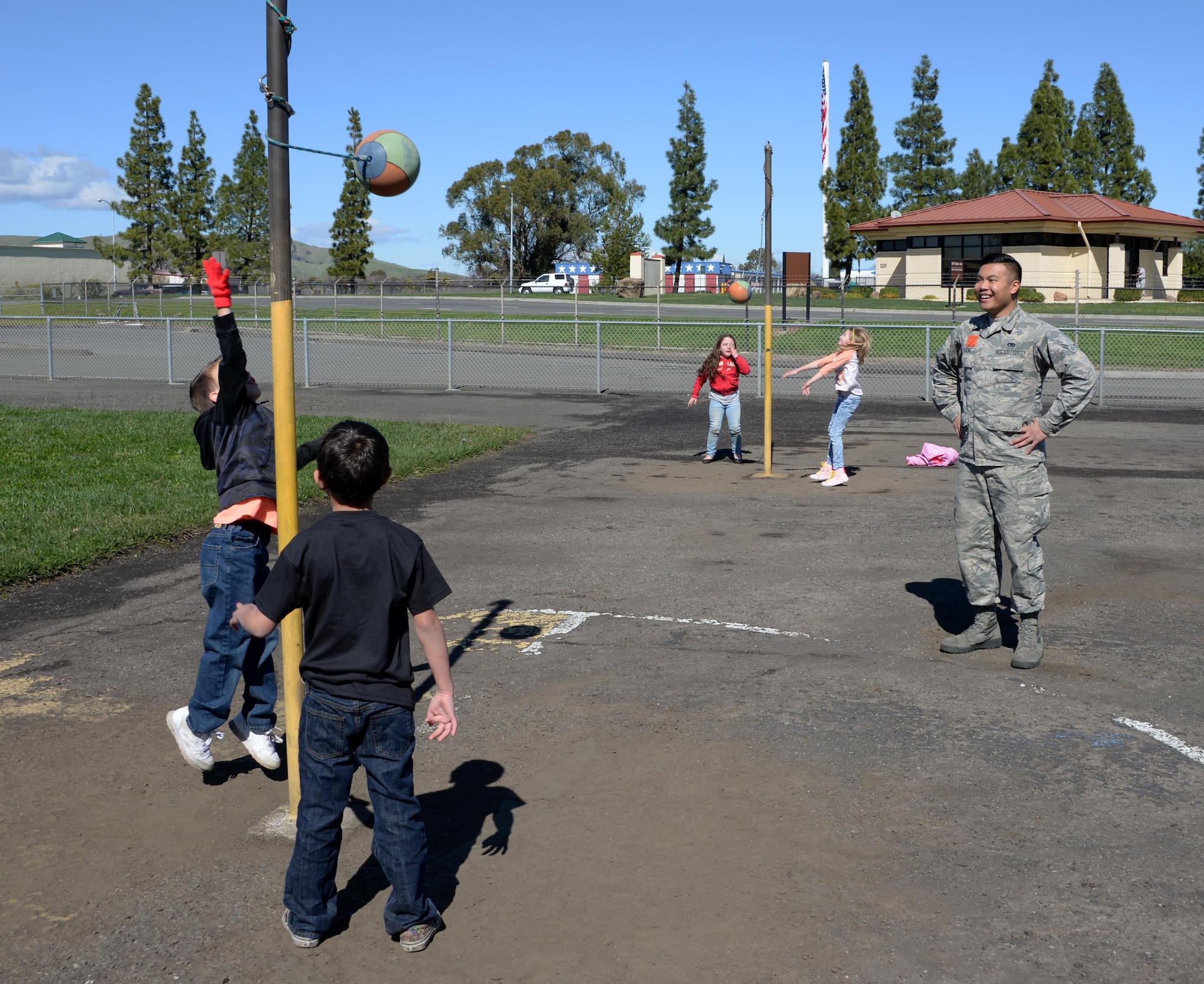 Airman 1st Class Frederick Cabling, 60th Aerial Port Squadron traffic management office, supervises children playing during recess at Travis Elementary School at Travis Air Force Base, Calif., Feb. 27, 2017. Cabling is one of nearly 70 Airmen who have volunteered at the school since Jan. 30. (U.S. Air Force photo/Tech. Sgt. James Hodgman/Released)