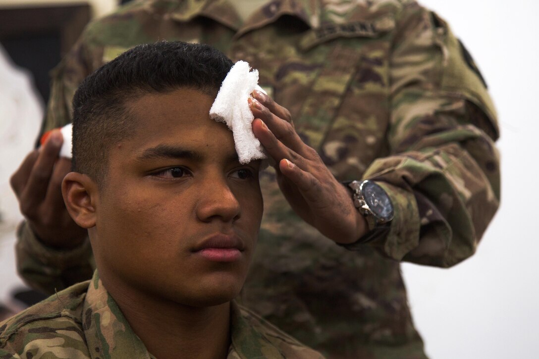 Army Sgt. Carlos Rodriquez has combat gauze applied to his head for a demonstration to Kurdish security forces during a tactical combat casualty care class near Erbil, Iraq, Feb. 19, 2017. Army photo by Spc. Craig Jensen
