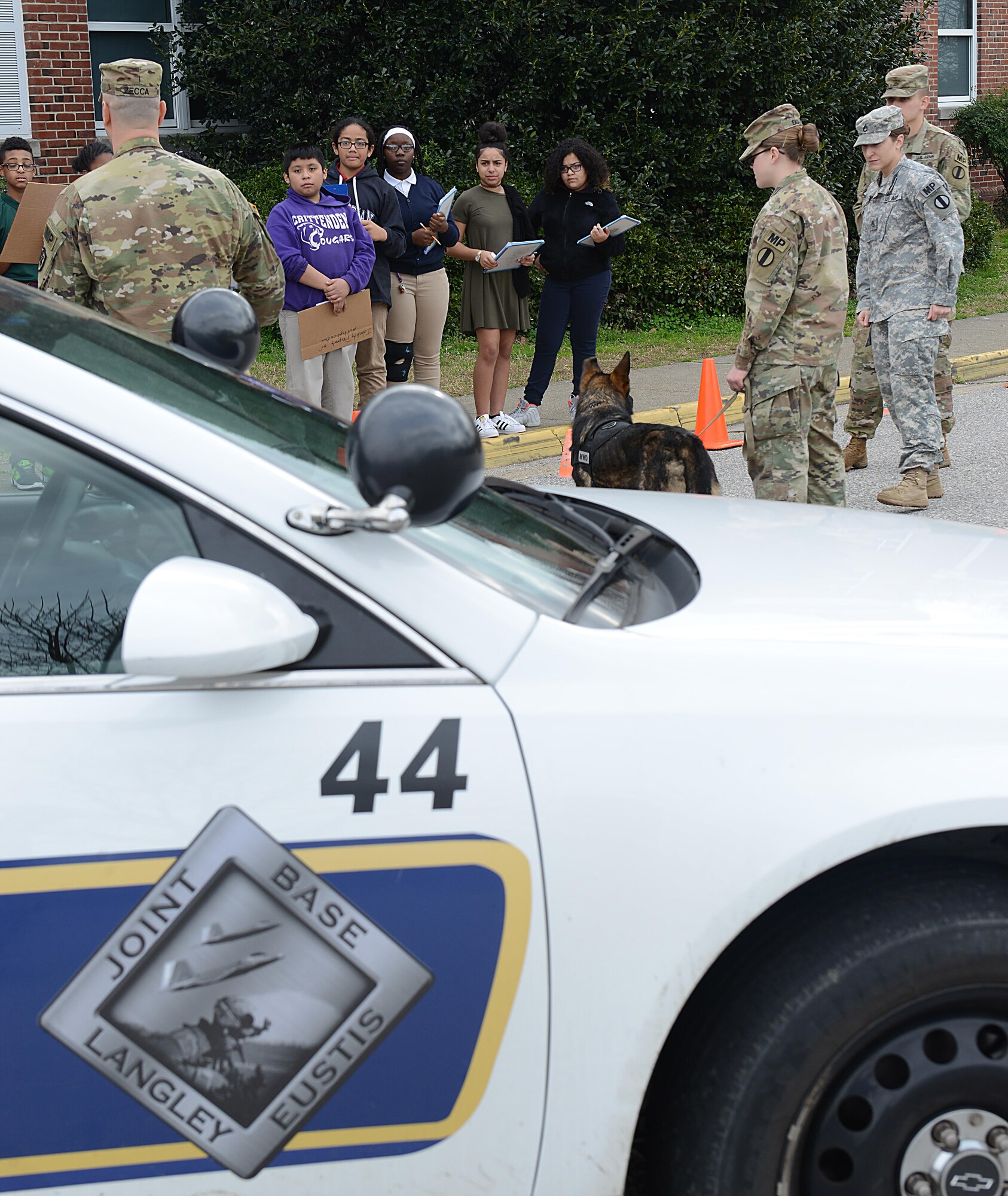 U.S. Army Soldiers from the 221st and 3rd Military Police Detachments at Joint Base Langley-Eustis, Va., explain the need for military working dogs during a career fair at Crittenden Middle School in Newport News, Va., Feb. 22, 2017. The objective of the career fair was to strengthen the relationships between the installation and the local community. (U.S. Air Force photo by Staff Sgt. Teresa J. Cleveland)