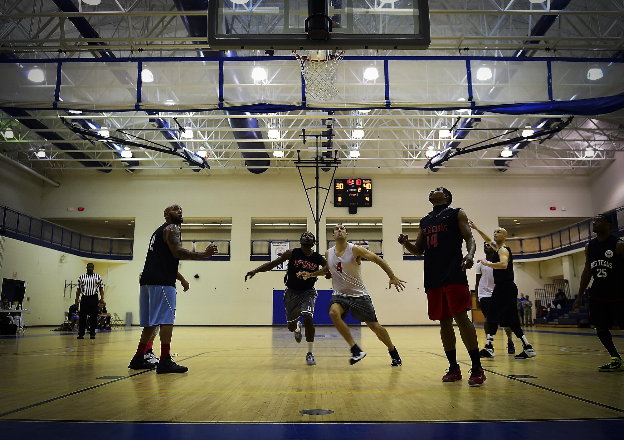 Members of the 2016-2017 intramural basketball game play during the championship game at Joint Base Langley-Eustis, Va., Feb. 22, 2017. The Ryan Center defeated the 633rd Force Support Squadron, redeeming themselves after their defeat last season. (U.S. Air force photo by Senior Airman Kimberly Nagle) 