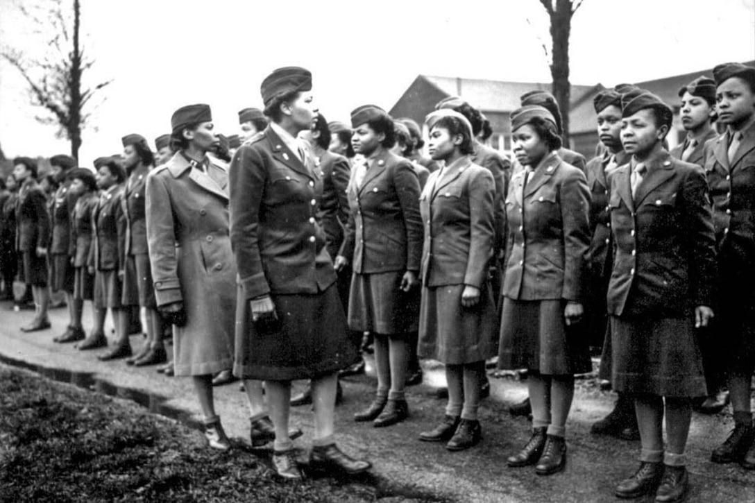 Women's Army Corps Maj. Charity Adams and Army Capt. Abbie Noel Campbell inspect soldiers
