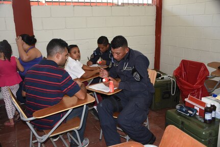 A police officer with the San Pedro Sula Metropolitan Police Unit Medical Brigade conducts a medical assessment during a medical civic action program mission in San Pedro Sula, Honduras, Feb. 18. Approximately 1,175 patients were seen in this one-day collaboration effort between local police, JTF-Bravo, local providers and private organizations. Working with Honduran police forces on joint exercises solidifies JTF-Bravo as a Partner-of-Choice for collaborative actions.