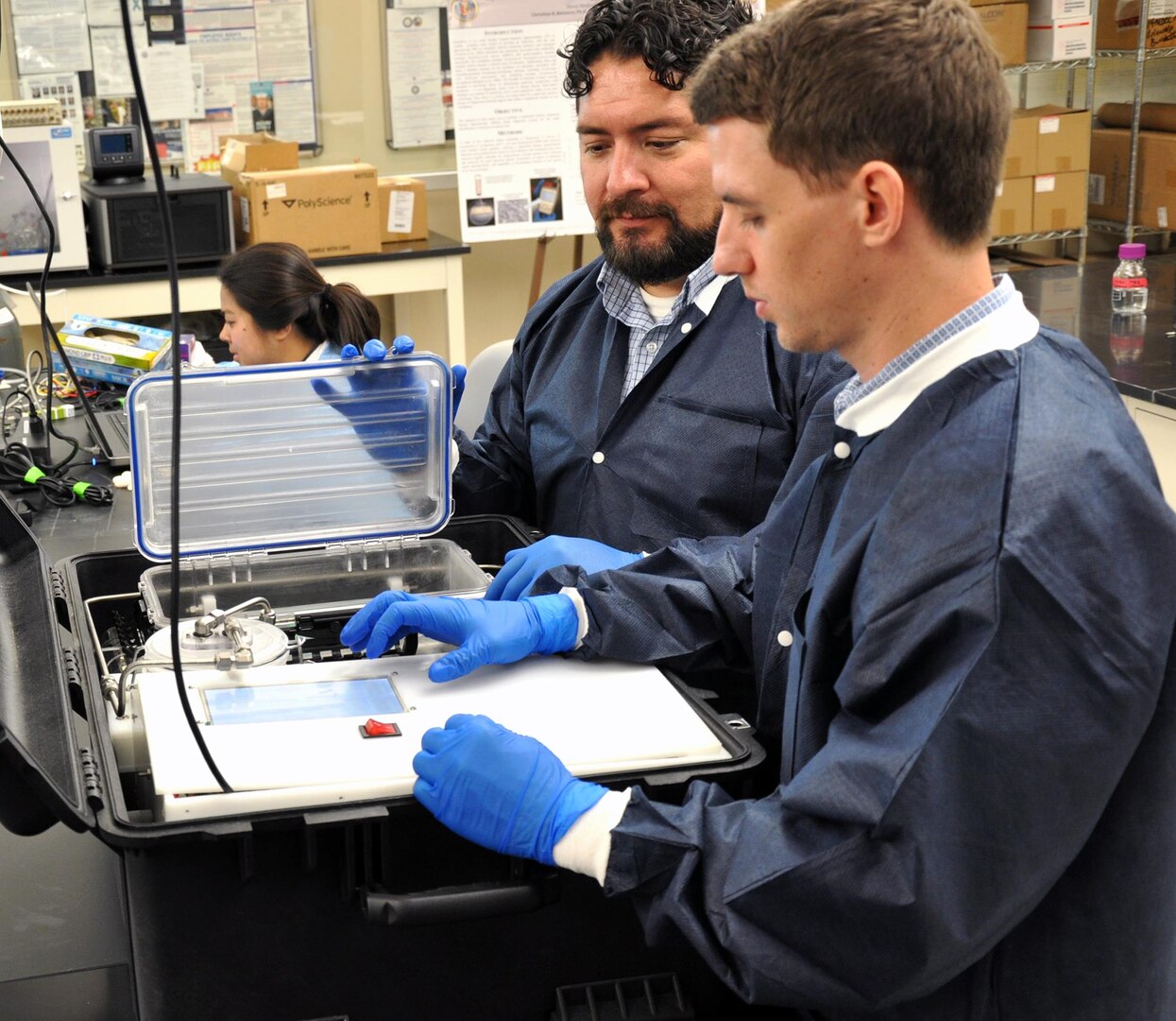 Roy Dory (right), biomedical engineer and head of NAMRU-SA’s Biomedical Systems Engineering and Evaluation Department is also the principal investigator for the field-ready portable ozone sterilizer project. Dory and team member Dr. Luis Martinez prepare to test the prototype.