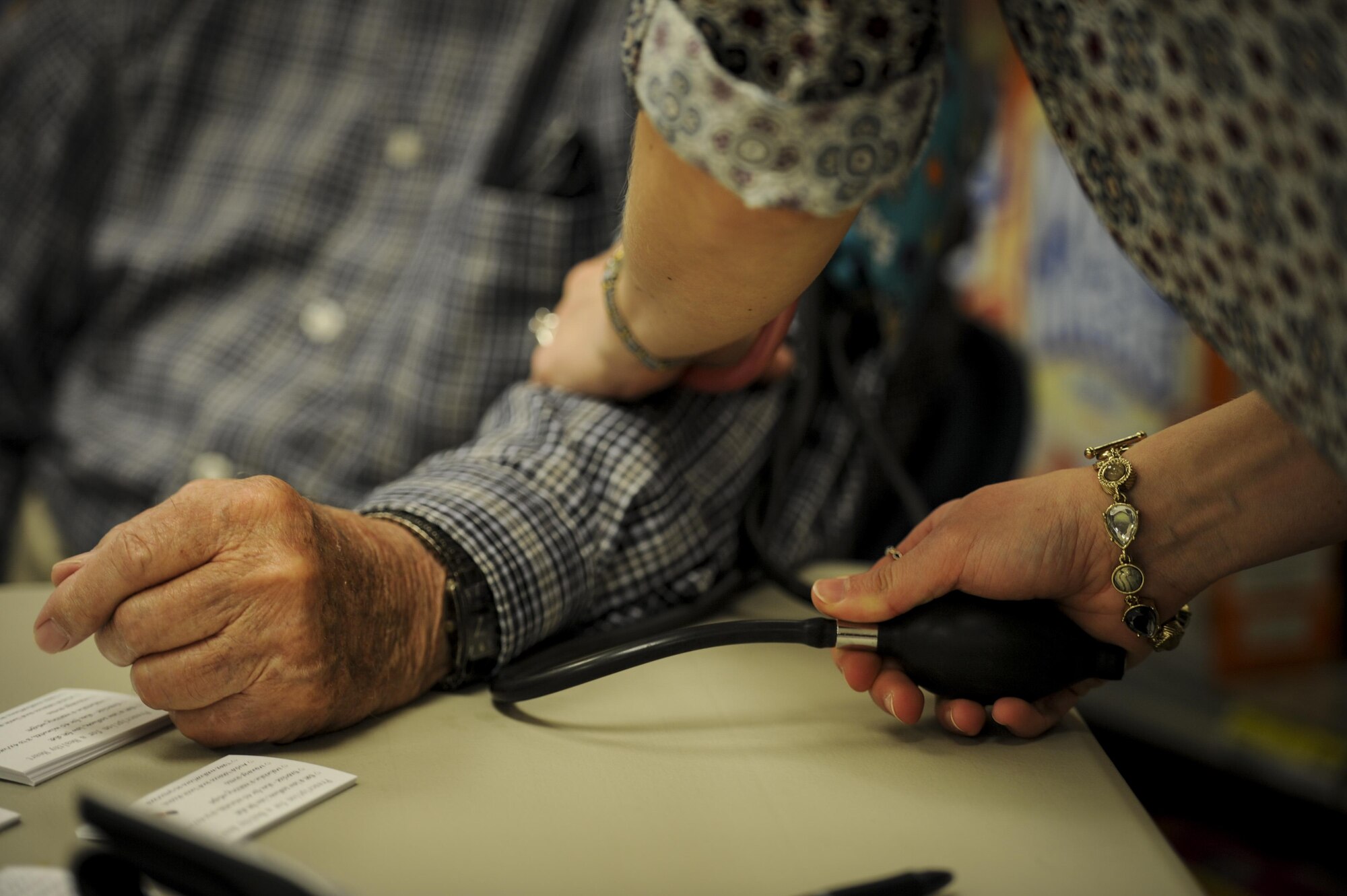 Charles Vickey, left, a retired brigadier general, gets his blood pressure checked at Hurlburt Field, Fla., Feb. 22, 2017. The Health and Wellness Center staff gave free blood pressure assessments, body mass index screenings, and tips for leading a heart-healthy life in recognition of National Heart Health Month. (U.S. Air Force photo by Airman 1st Class Dennis Spain)