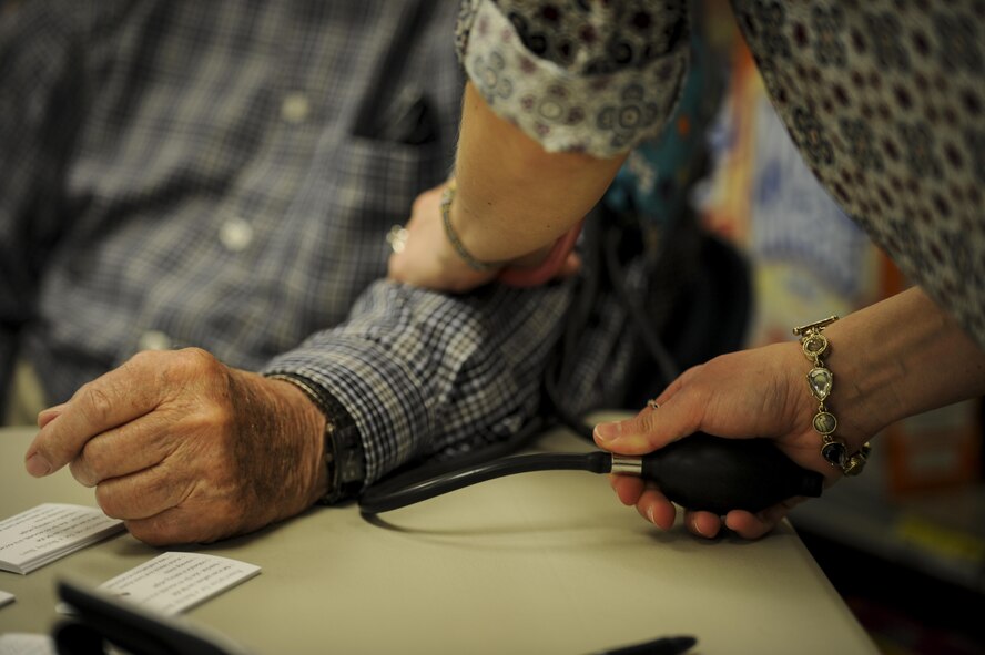 Charles Vickey, left, a retired brigadier general, gets his blood pressure checked at Hurlburt Field, Fla., Feb. 22, 2017. The Health and Wellness Center staff gave free blood pressure assessments, body mass index screenings, and tips for leading a heart-healthy life in recognition of National Heart Health Month. (U.S. Air Force photo by Airman 1st Class Dennis Spain)