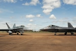 A Royal Australian Air Force E-7A Wedgetail taxies behind a RAAF 75 Squadron F/A-18A/B Hornet and U.S. Air Force 90th Fighter Squadron F-22 Raptor at RAAF Base Tindal, Australia, Feb. 24, 2017. Twelve F-22 Raptors and approximately 200 U.S. Air Force Airmen are in Australia as part of the Enhanced Air Cooperation, an initiative under the Force Posture Agreement between the U.S. and Australia. 