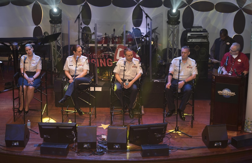 Members of the U.S. Air Force Band Singing Sergeants ensemble answer questions during a panel at Universal Studios Orlando, Fla., Feb. 23, 2017. During the panel audience members were invited to ask questions and learn about the Singing Sergeants role in the U.S. Air Force Band's mission. (U.S. Air Force photo by Airman First Class Rustie Kramer)