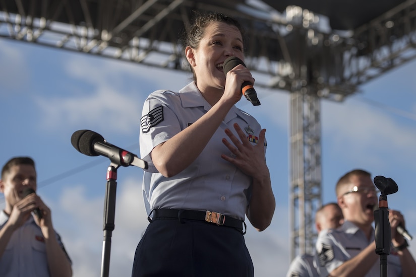 Tech. Sgt. Jilian McGreen, U.S. Air Force Band Singing Sergeants ensemble mezzo-soprano vocalist, sings "The Trolley Song" during a performance at Universal Studios Orlando, Fla., Feb. 23, 2017. The Singing Sergeants performed a variety of hits from the 1940s and '50s for audience members during a series of free concerts. "The Trolley Song" from the 1944 film "Meet Me in St. Louis" was originally sung by actress Julie Garland. (U.S. Air Force photo by Airman First Class Rustie Kramer)