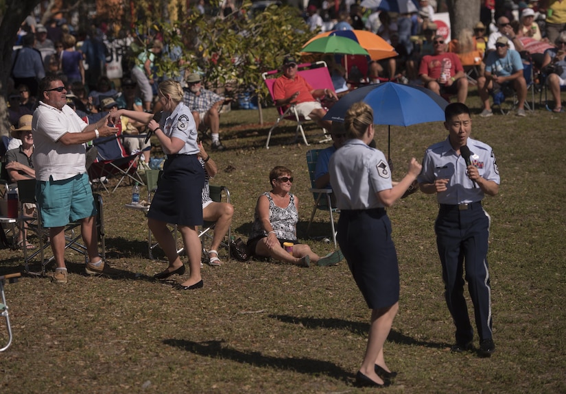 Members of the U.S. Air Force Band Singing Sergeants ensemble dance with audience members during a performance in Cape Coral, Fla., Feb. 26, 2017. The ensemble performed a variety of popular hits from the 1940s and '50s, as well as a selection of classical choral literature, for audiences in central Florida. (U.S. Air Force photo by Airman 1st Class Rustie Kramer)