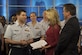 Capt. Daniel Booth, U.S. Air Force Band assistant director of operations and associate conductor, speaks with Bob Frier and Amy Kaufeldt, co-hosts of 'Good Day Orlando', in Lake Mary, Fla., Feb. 21, 2017. During the broadcast the ensemble performed snippets of patriotic music from their program and gave an overview of their weeklong tour. (U.S. Air Force Photo by Airman 1st Class Rustie Kramer)