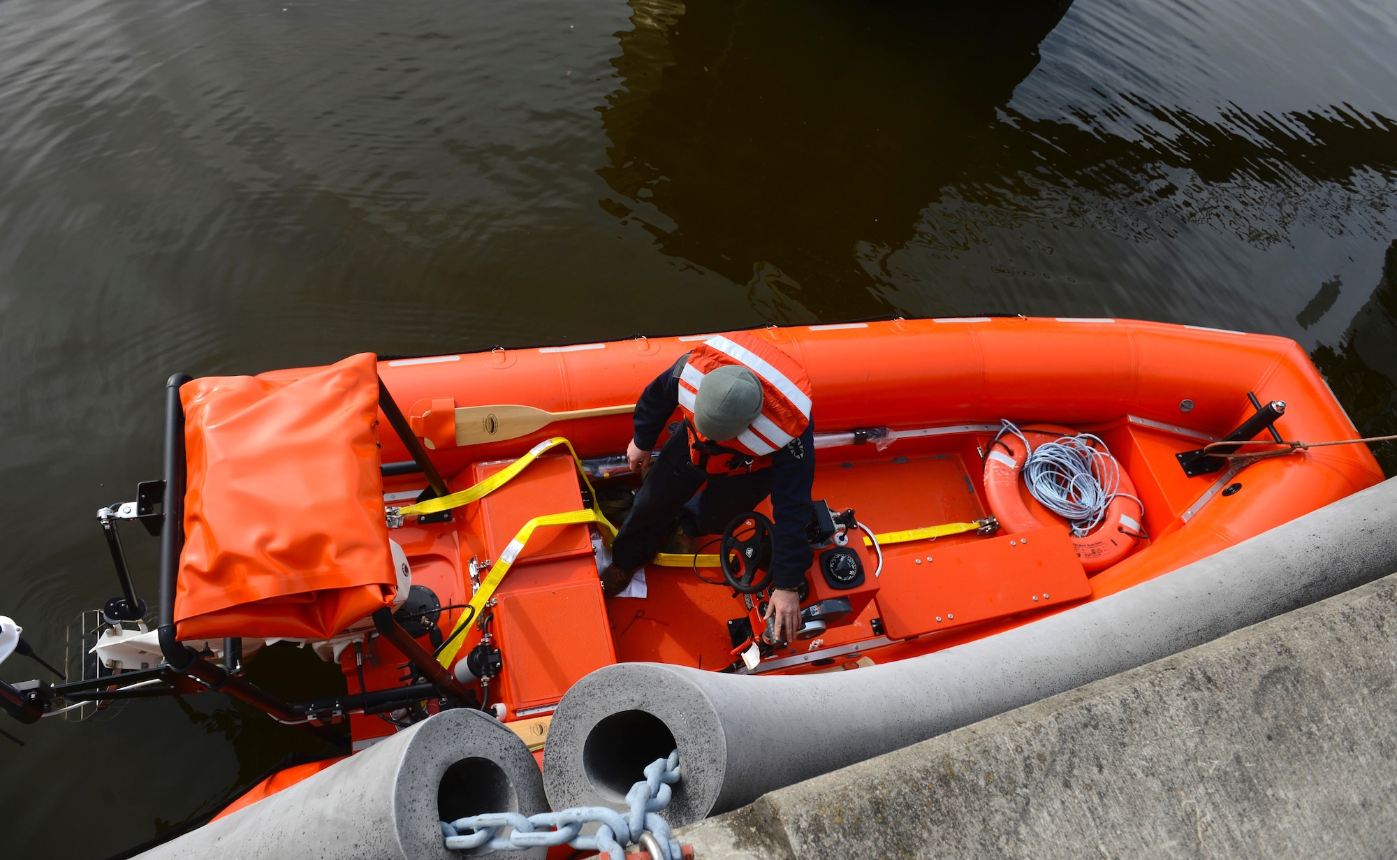 U.S. Army Sgt. Dane Havener, 73rd Transportation Company, 10th Battalion, 7th Transportation Brigade (Expeditionary) senior engineer, prepares a vessel for a training mission at Third Port at Joint Base Langley-Eustis, Va., Feb. 22, 2017. Along with the Ridged Hall Inflatable Boat, Third Port houses LCM-8 Mike Boats, LSV-1 Besson and a landship, which are also used for training purposes. (U.S. Air Force photo by Airman 1st Class Kaylee Dubois)