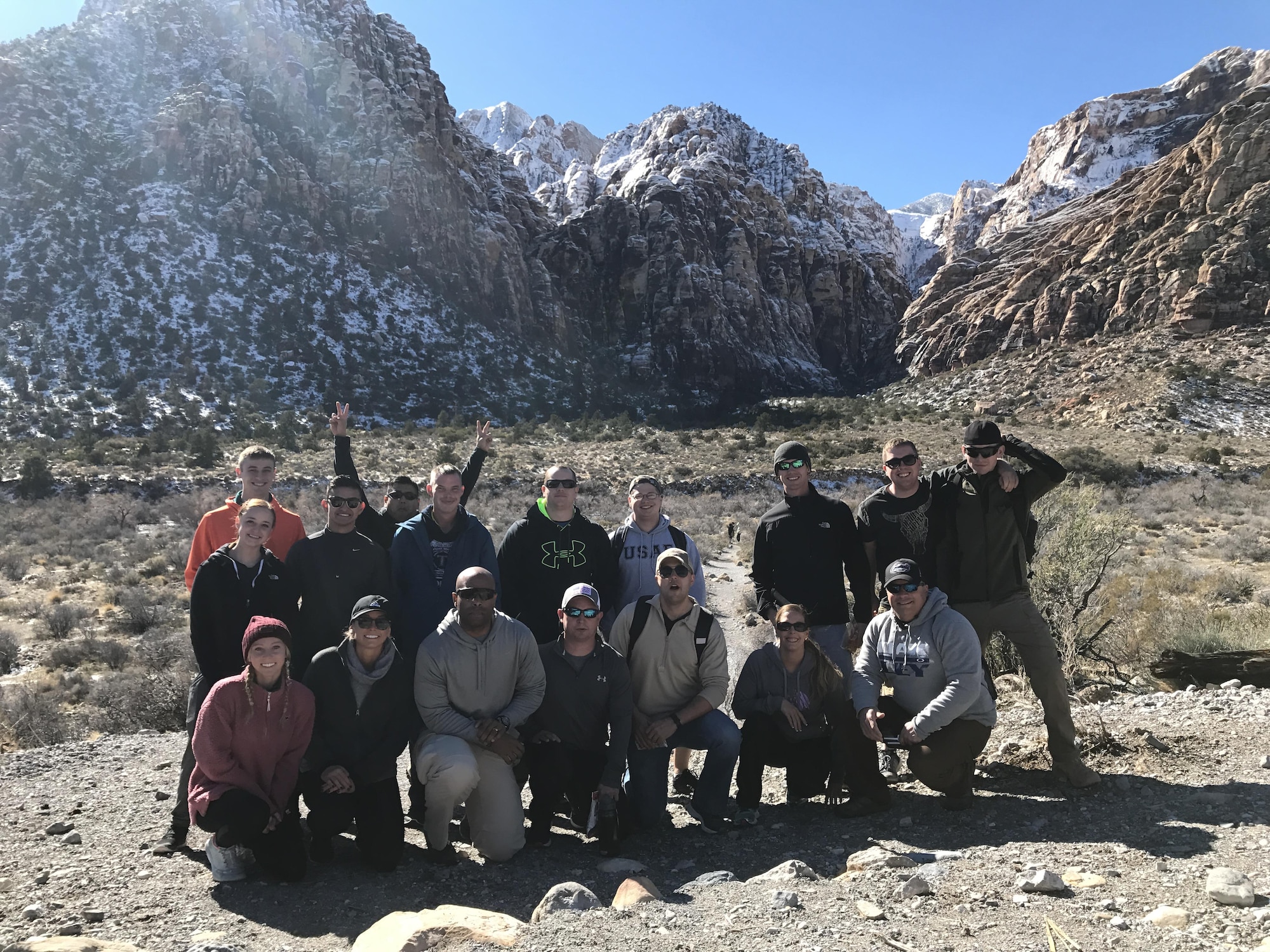 The Moody Air Force Base chapel team and 23d Maintenance Group Airmen pose for a photo after hiking at Red Rock, Nev., Jan. 21, 2017. Several units from the 23d MXG and Nellis’ 823d Maintenance Squadron prepared for future deployments during the Green Flag-West 17-03, a two week air-land integration combat exercise. As a result of the chapel team’s support, the 23d MXG leadership wants to continue building a partnership with the base’s religious support teams to provide counsel for resiliency and religious aid to their maintainers at home and abroad. (Courtesy photo)