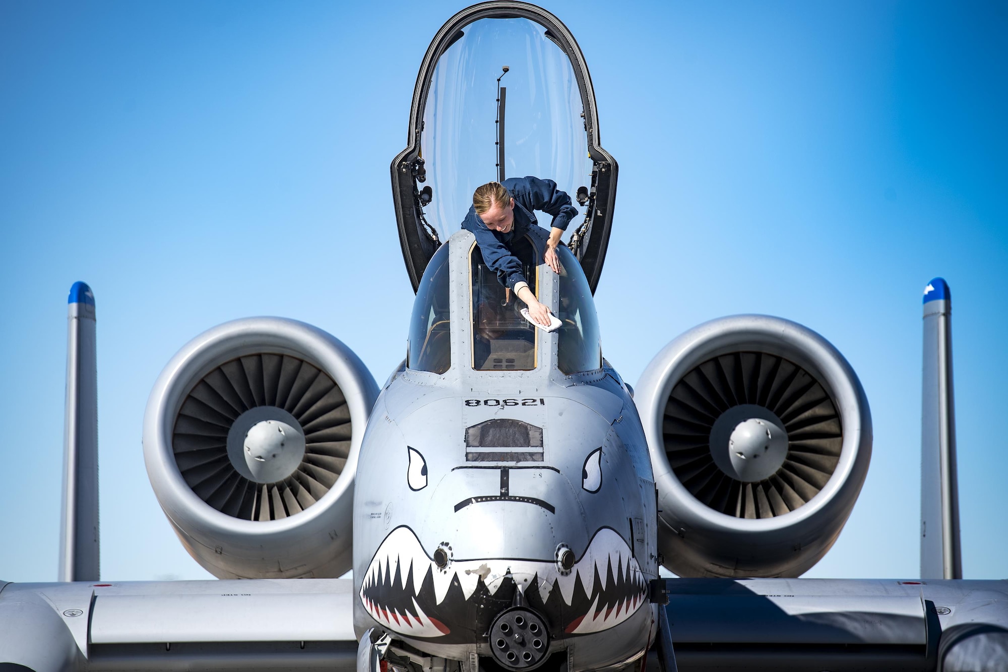 Senior Airman Felicia Anderson, 74th Aircraft Maintenance Unit crew chief, cleans the cockpit glass of an A-10C Thunderbolt II during Green Flag-West 17-03, Jan. 25, 2017, at Nellis Air Force Base, Nev. During the air-land integration combat exercise, the Moody Air Force Base Chapel team engaged with the maintainers on building resiliency away from home station. “Sometimes being away from home station can prove to be frustrating in itself,” said Anderson. “Leaving your comfort zone is challenging, but it's something those of us striving to complete these missions get used to. During Green Flag, having our spirits uplifted refocused us on the mission and helped us get the jets ready to finish our training. It was a great experience.” (U.S. Air Force photo by Staff Sgt. Ryan Callaghan)