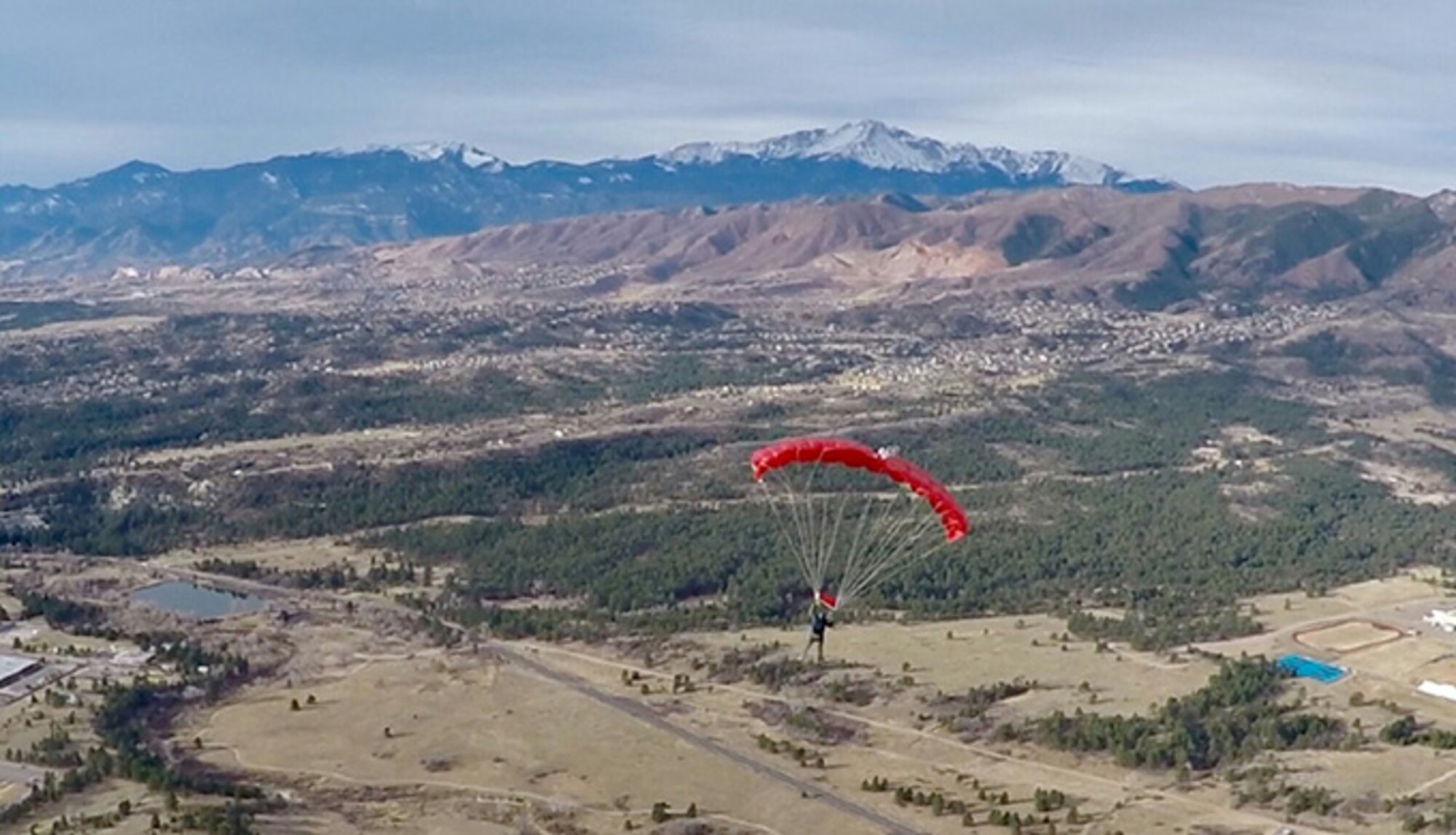 Master Sgt. Israel Del Toro Jr., makes his 131st parachute jump over the U.S. Air Force Academy, Feb. 18, 2017. Del Tori, a former Tactical Air Control Party Airman, is the Air Force's only 100-percent disabled wounded warrior on active duty. He made the jump with cadets and staff at the 98th Flying Training Squadron. (U.S. Air Force photo)
	