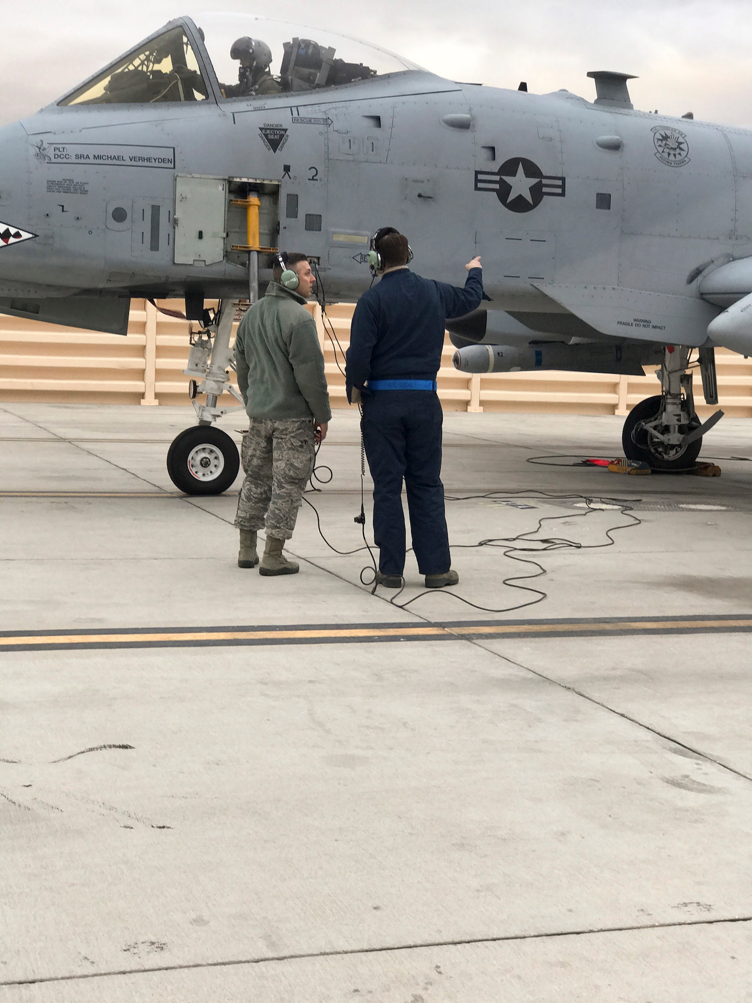 Chaplain (1st Lt.) Gerald Stout, 23d Wing chaplain, talks to a 23d Maintenance Group Airman during Green-Flag West 17-03, (date), at Nellis Air Force Base, Nev. The chapel team traveled from Moody Air Force Base, Ga., to participate, observe and encourage 200 Airmen during their A-10C Thunderbolt II maintenance efforts with counseling on strengthening their resiliency and provided religious aid. (Courtesy photo) 