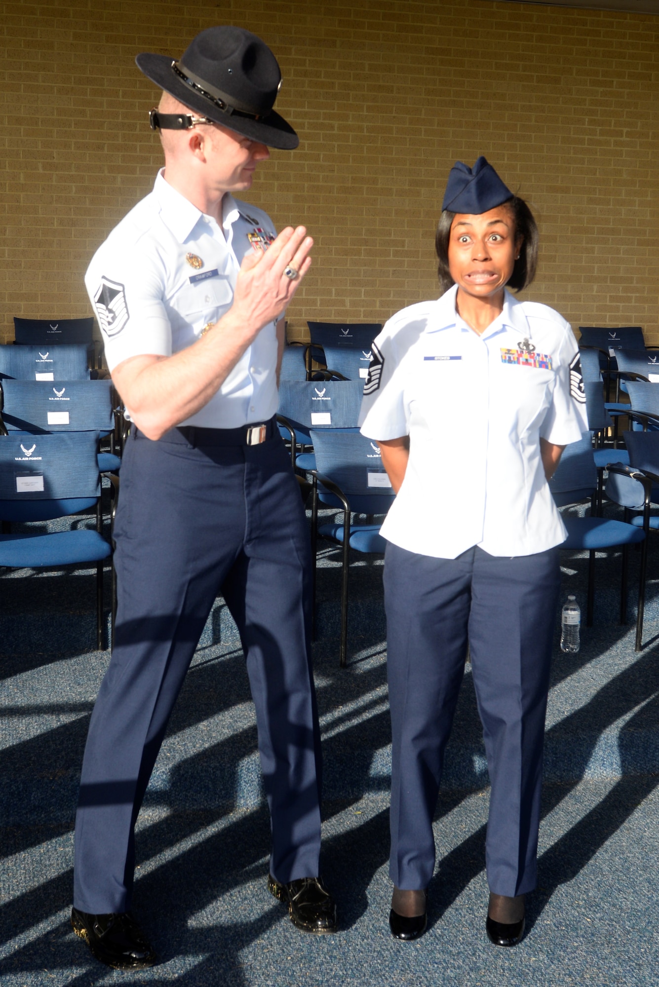 Master Sgt. Michael Crawford, 323rd Training Squadron military training instructor, reminds Master Sgt. Erica Stokes, 90th Medical Group first sergeant, of her Basic Military Training experience at Lackland Air Force Base, Texas, Feb. 24. Crawford led a two-day tour of BMT for noncommissioned officers from F.E. Warren AFB, Wyo. The Airmen attended the Airman’s Run, Coining Ceremony and Graduation Parade as well as tours of the newest training facilities on the installation. (U.S. Air Force Photo by 1st Lt Esther Willett)