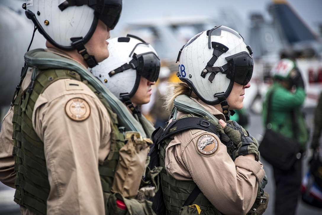 Sailors prepare to board an MH-60R Seahawk on the USS Carl Vinson in the Luzon Strait, Feb. 18, 2017. The aircraft carrier is deployed as part of the U.S. Pacific Fleet-led initiative to extend the command and control functions of U.S. 3rd Fleet. The sailors are assigned to Helicopter Maritime Strike Squadron 78. Navy photo by Petty Officer 2nd Class Sean M. Castellano