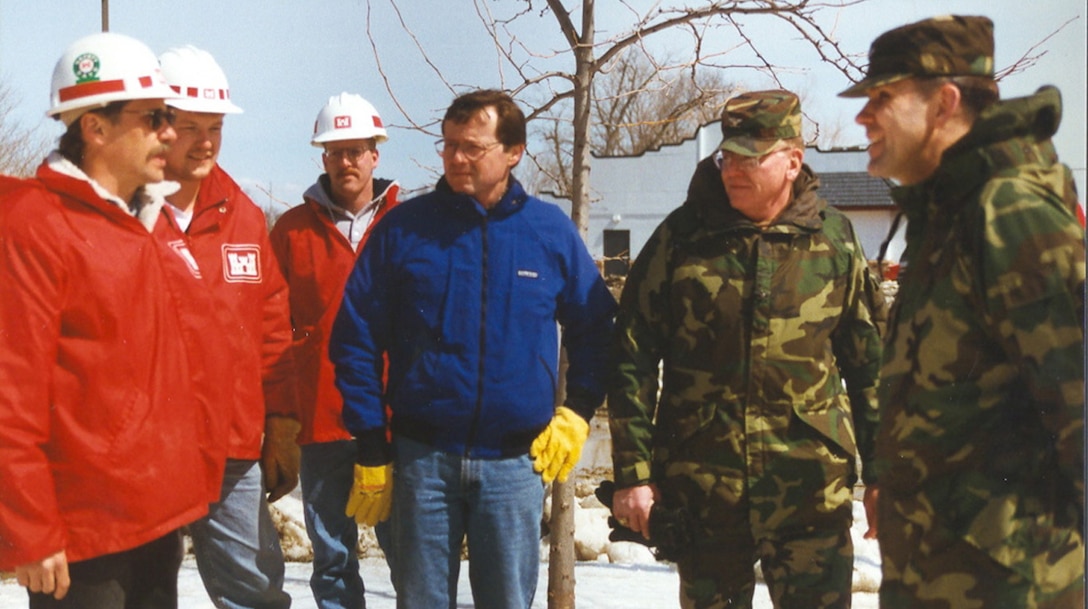 Matt Bray and Tim Grundhoffer, engineering; Pete Corkin, Rock Island District; U.S. Rep. Earl Pomeroy; Col. Mike Wonsik, St. Paul District commander; and Maj. Gen. Russell Fuhrman, Mississippi Valley Division, at Breckenridge, Minn., during the floods of 1997. --USACE St. Paul District File Photo