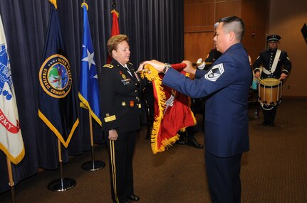 U.S. Army Maj. Gen. Heidi V. Brown, U.S. Strategic Command (USSTRATCOM) director of global operations, observes U.S. Air Force Chief Master Sgt. Timothy W. Garcia, senior enlisted leader of USSTRATCOM global operations, furling of the personal colors during her retirement ceremony in the 557th Weather Wing auditorium, Offutt Air Force Base, Neb., Feb. 24, 2017.  Brown served more than 35 years in the U.S. Army and will effectively retire Apr. 1, 2017.  Brown holds many distinctions, including the first woman to command and lead a U.S. Army brigade into combat, the first female general in the U.S. Army Air Defense Artillery Branch, the senior female combat arms officer in the Army and the first female combatant command operations director.  Brown arrived at USSTRATCOM in February 2015, after serving as Missile Defense Agency’s test director at Fort Belvoir, Md.  One of nine DoD unified combatant commands, USSTRATCOM has global strategic missions assigned through the Unified Command Plan that include strategic deterrence; space operations; cyberspace operations; joint electronic warfare; global strike; missile defense; intelligence, surveillance and reconnaissance; and analysis and targeting.