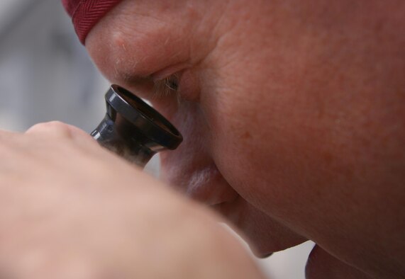 Lt. Col. Chester Barton, 374th Ear Nose and Throat Clinic otolaryngologist, examines a patient for nasal damage at Yokota Air Base, Japan, Feb. 16, 2017. The Yokota ENT clinic is the only U.S. Air Force ENT clinic in Japan and regularly supports surrounding bases with everything from aching heads to broken faces. (U.S. Air Force photo by Senior Airman Elizabeth Baker)