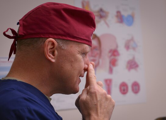 Lt. Col. Chester Barton, 374th Ear Nose and Throat Clinic otolaryngologist, explains treatment options to a patient with a broken nose at Yokota Air Base, Japan, Feb. 16, 2017. From treating aching heads to broken faces, the ENT team is a vital part of what keeps Japan’s U.S. Air Force healthy. (U.S. Air Force photo by Senior Airman Elizabeth Baker)