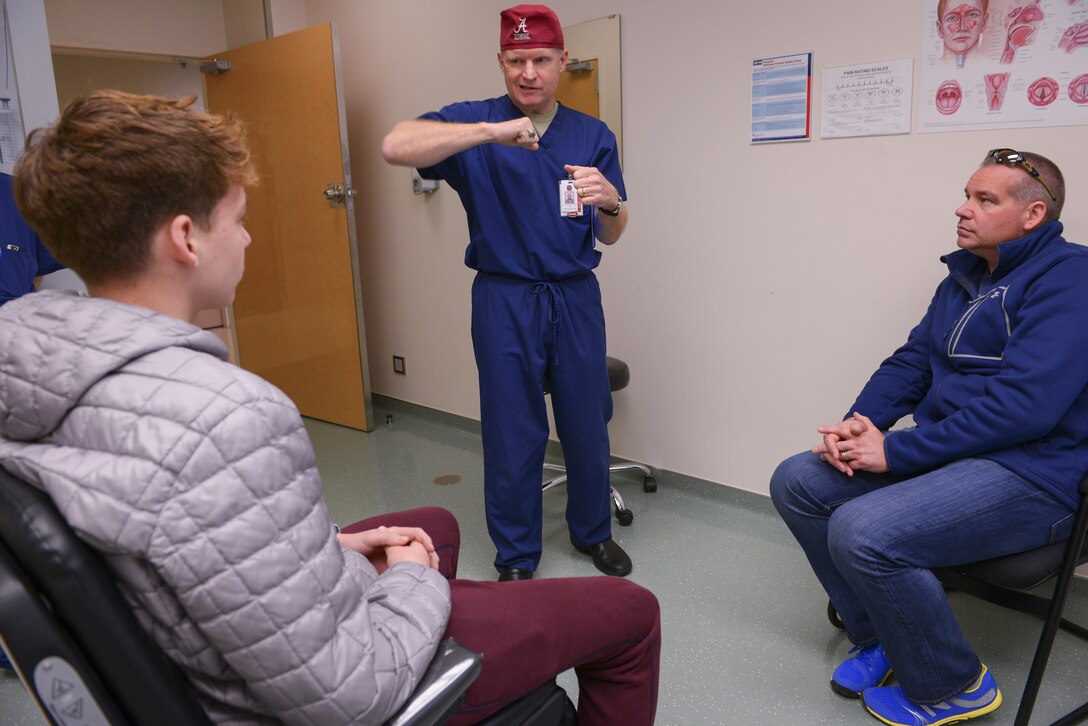 Lt. Col. Chester Barton, 374th Ear Nose and Throat Clinic otolaryngologist, explains treatment options to a patient with a broken nose at Yokota Air Base, Japan, Feb. 16, 2017. From treating aching heads to broken faces, the ENT team is a vital part of what keeps Japan’s U.S. Air Force healthy. (U.S. Air Force photo by Senior Airman Elizabeth Baker)